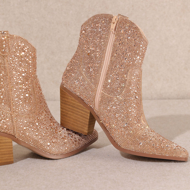 Angel Kisses! Add Glamour to any party with these rose gold Rhinestone Booties with allover rhinestone detailing. Pointed Toe Silhouette,  side zipper closure, 3" wooden block heel, 5" ankle length from ankle to top of bootie. 8 1/2" total inches tall from sole to top of Bootie. 