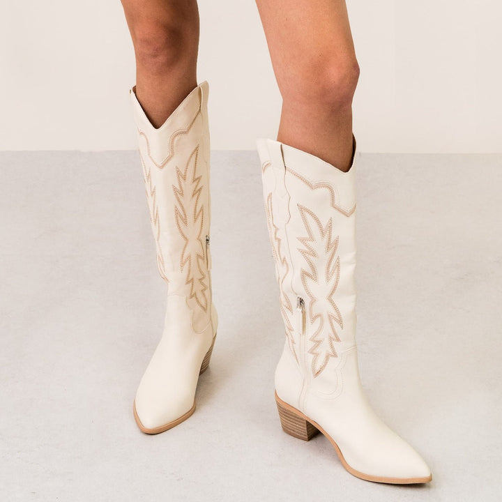 Miim Shoes I Gussieduponline. off white. boots. knee high boots. faux leather. zip up. cowgirl boots. whip stitch. western. western cowgirl boots. small business. Woman Owned Boutique. Ships fast from Texas. 