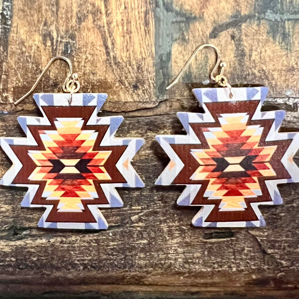 The Ancient Aztec Earrings are a 2" Aztec Cutout with a colorful Aztec Print Design. They are on a fish hook earring. They are very lightweight and beautiful with the color combination.  