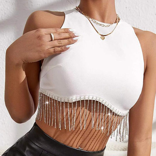 Make a statement with this daring crop top! The dazzling rhinestone fringe brings a glimmer to the room, perfect for your next fancy event. Zip up the back to embrace a flattering silhouette, then step out and sparkle!  Fabric Contents 95% polyester,5% spandex