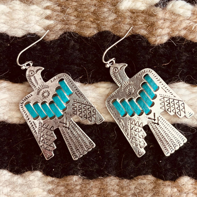 The Turquoise Tai Juni Thunderbird Earrings are so gorgeous. The beautiful 2" Silver Thunderbird with the turquoise leather strap inlay are so dainty and make these earrings stand out when wearing them. You wont want to miss out on this pair!!