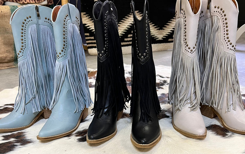 These Beastly Fringe Boots are casual fringe western boots. The come in Grey, Blue, & Black.  These boots are 14 1/2" from heel to boot tops. Featuring 11" fringe down the front and sides with small nail stud detail. They are pointed toe and have a 2 1/2" heel. Inside zipper closure