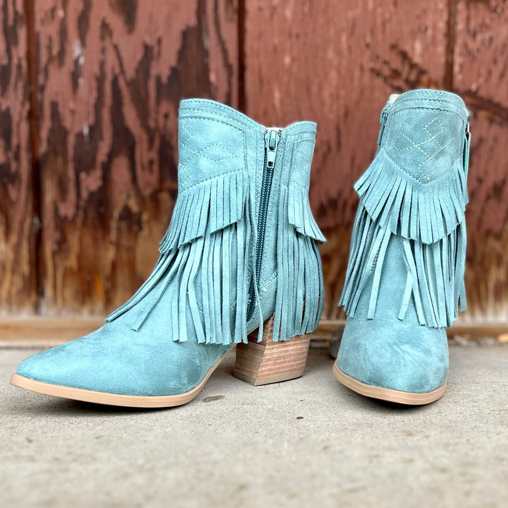 These Showstopping Underneath The Blue Moon Booties are Absolutely Stunning. They are turquoise in color with turquoise fringe on the front and back. They feature a 6" inside zipper and a 3" heel. They are pointed top for that dressy look. They are 8 1/2" total height from sole to top of bootie.