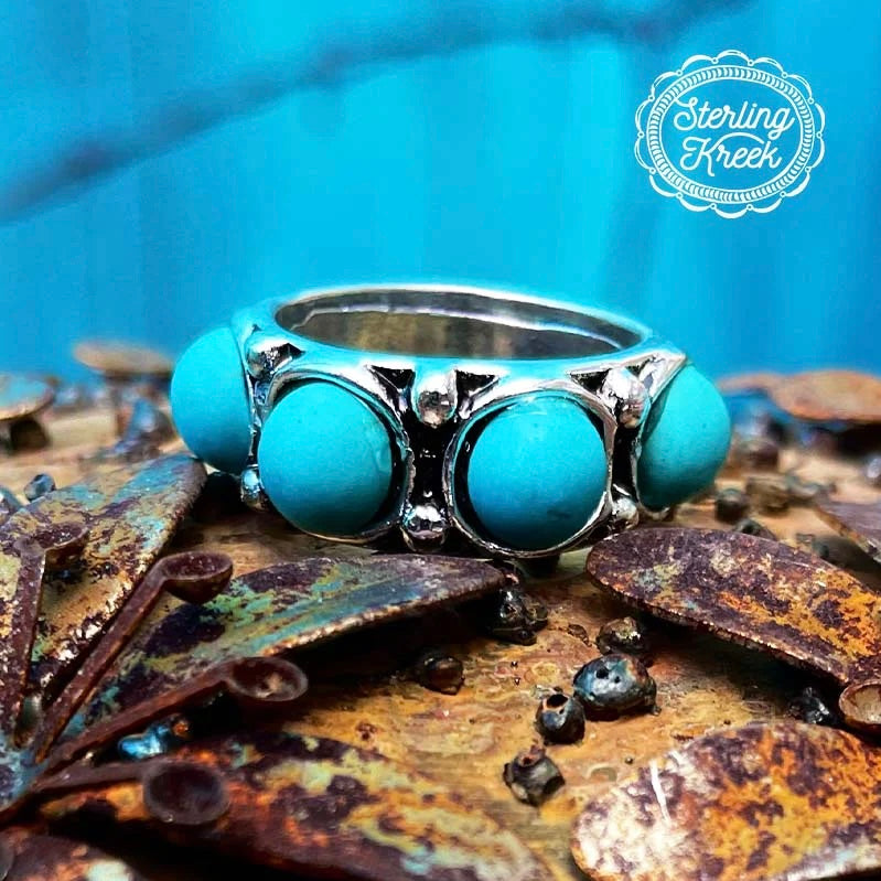 The Full House Ring features gorgeous silver detail and (4) 1/4" Turquoise Stones on Top. This Ring is the Perfect Size and not bulky or heavy. Would look adorable on any ladies hand.