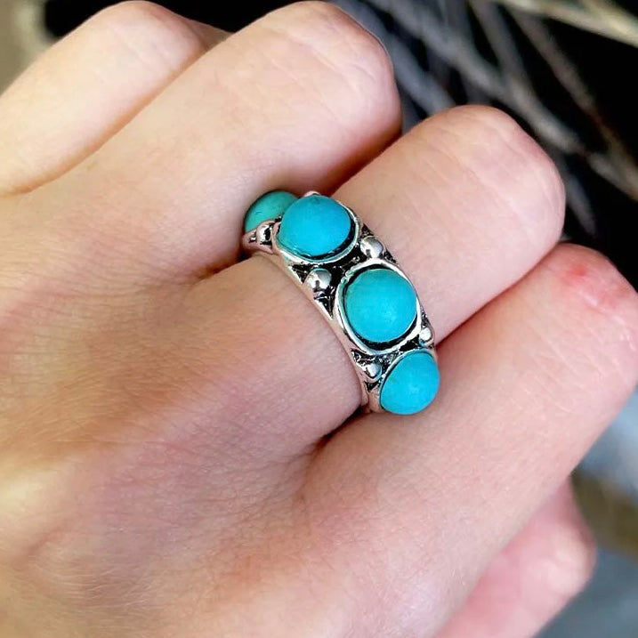 The Full House Ring features gorgeous silver detail and (4) 1/4" Turquoise Stones on Top. This Ring is the Perfect Size and not bulky or heavy. Would look adorable on any ladies hand.
