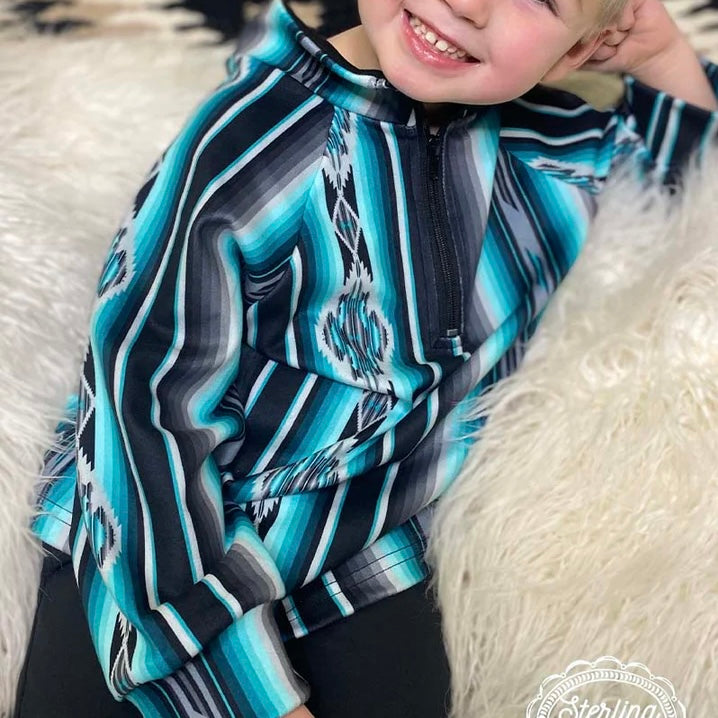 The Kids Little Rock Pullover is a 3/4 zip pullover that is absolutely beautiful! The turquoise colors with the black and grey make this pullover stand out. And the Material is butter soft and so comfortable. 32% Cotton, 56% Rayon, 12% Spandex  6-12M, 2/3T, XS, S, M. L, XL
