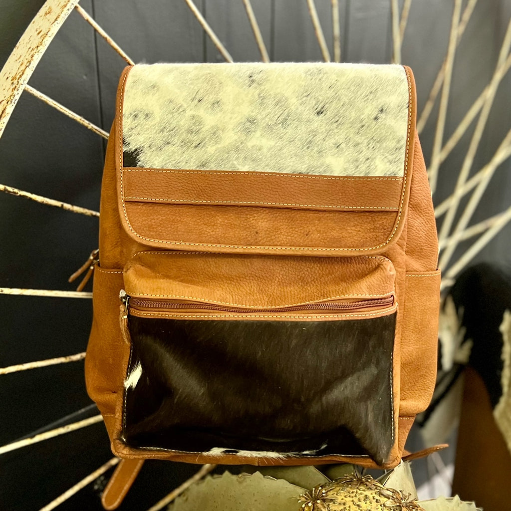 The Grand Canyon Backpack is a Beautiful Soft Leather Hair On Hide backpack that can used as a backpack or a laptop carrier. The backpack has so many pockets and room for multiple uses.   Dimensions 15" W X 15" H
