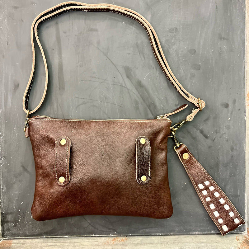 MADE BY MYRA HANDBAGS  The Floral Beryl Crossbody Wristlet is  a Dark Brown and Turquoise Tooled Leather Wristlet. The bag features a 7" adjustable/removable wristlet strap or a 24" removable/adjustable crossbody strap. The bag features a top zipper closure.   Dimensions: 9.5" W X 7" H