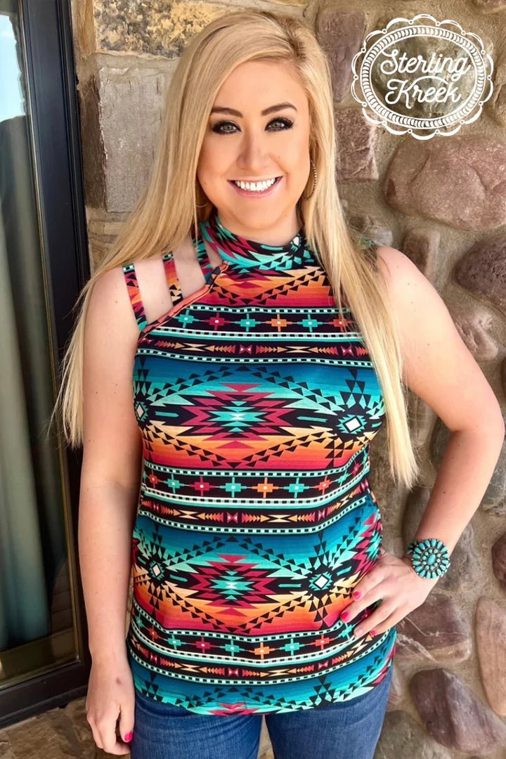 Chill in Luckenbach, Texas with this tank that has personality to spare. The AZTEC design with a high neck line and cut outs on one shoulder make for a stylish yet comfy piece you can rock at any event! So throw on your Luckenbach Lovin' Tank and enjoy the good vibes!  50% POLYESTER 45% COTTON 5% SPANDEX
