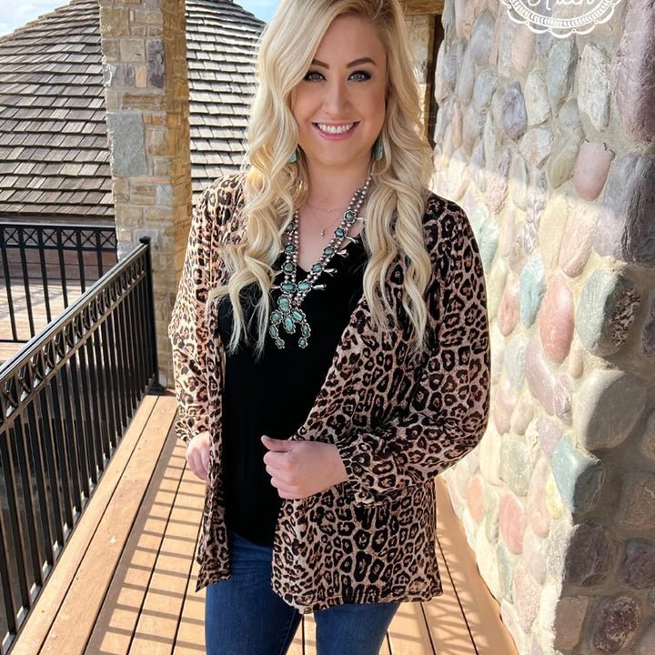 Feel the wild side with this leopard print cardi! Slip into this long sleeve mesh cardigan and you'll be roarin' with style. Its lightweight fabric will keep you cozy during your wild adventures. Get the look that purrs with personality!  96% Polyester, 4% spandex  length-33.25"  O/S - Fits XS-3XL