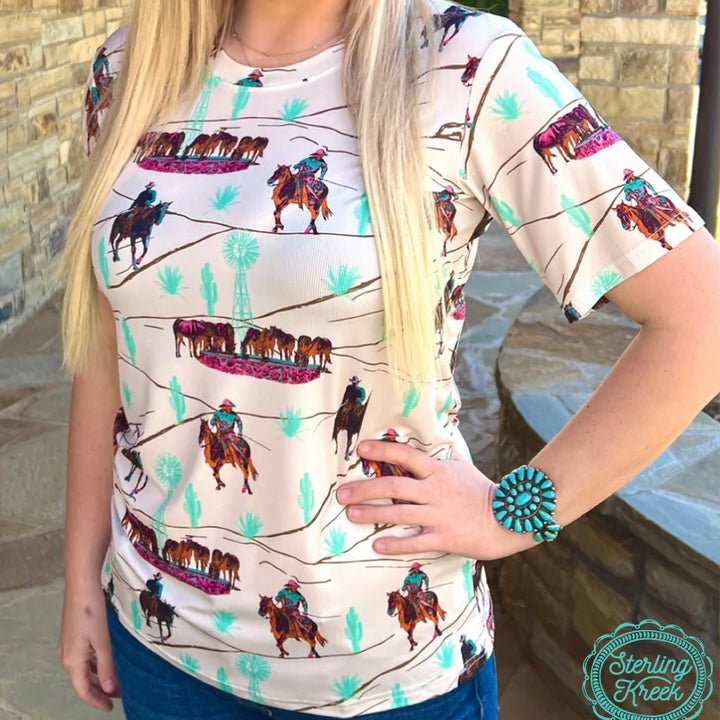 Get ready to be the talk of the town with this BIG RANCHIN TOP! This comfy cream top has a fun ranch pattern sure to turn heads. With its easy style and vibrant design, you’ll be ready for any occasion! So ranch-y you’ll want to wear it twice!