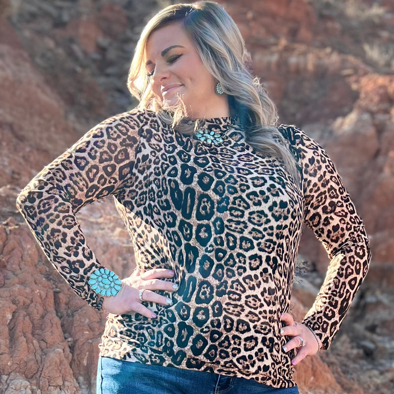 leopard!! Wear this top under a short sleeve tee or top for a layering look or as a regular top with a cute tank or tube top underneath! This top is super comfy and true to fit!  MARIAH IS WEARING - XS  SYLESTE IS WEARING - XL  96% POLYESTER 4% SPANDEX