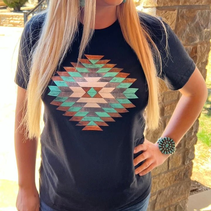 Dress to impress in this Cedar Kreek Tee! It's the perfect blend of black and woodsy, with a cool aztec design to make your look stand out from the rest. You're sure to turn heads with this sleek, modern tee!