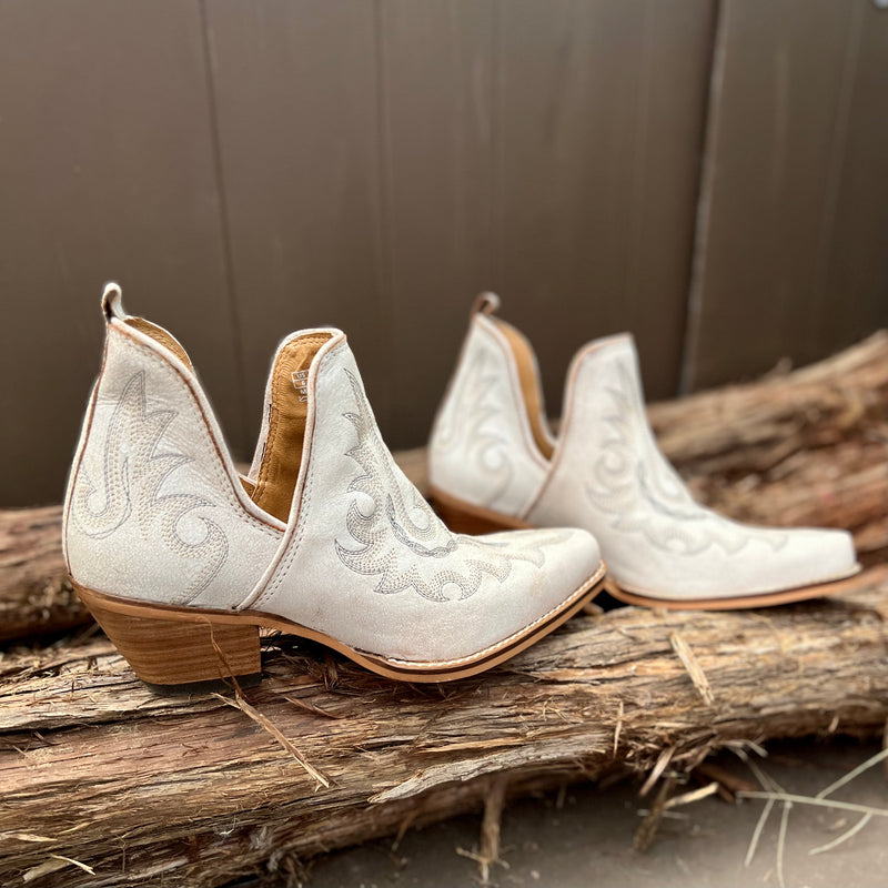 By Myra  Genuine cream leather notched ankle booties with decorative contrast stitching in tan. Pointed toe. Cushioned foot bed for optimal comfort.  Size down 1 size, these booties run big!!