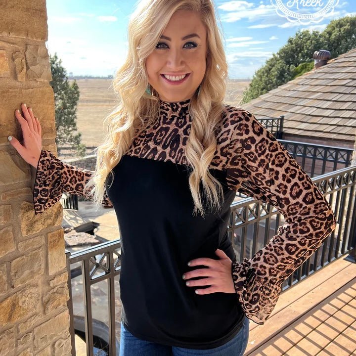 Join the wild side in our Nothing to Lose Top! This fierce look will have heads turning. With a black bottom and a leopard mesh top, feel wild, sexy, and unstoppable in this show-stopping top! When you wear it, you’re guaranteed to have a “roar-some” night!  94% MODAL 6% SPANDEX
