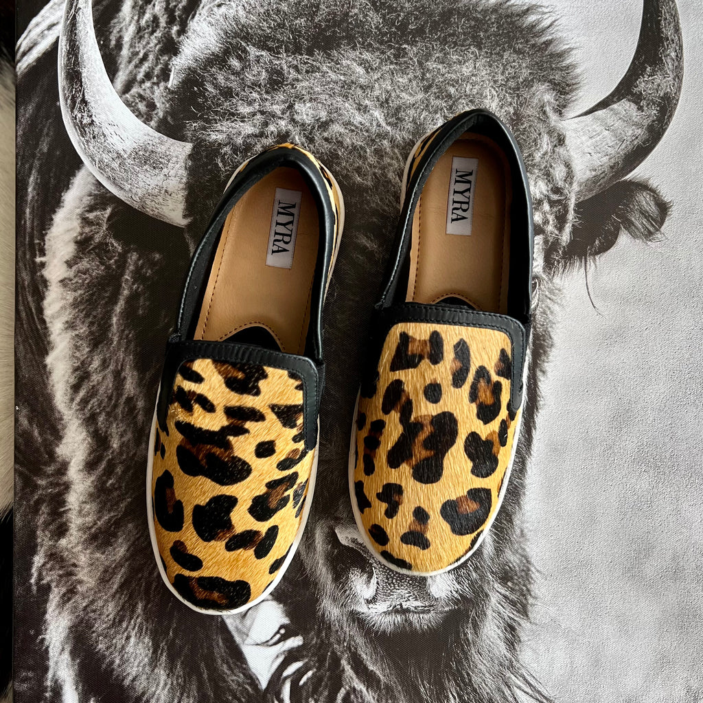 By Myra  Give your feet some style with these classic leopard hair on hide leather flat sneakers. They'll be your go-to pick for casual office days, shopping, or dress them up for a night on the town.   True to size, if between sizes size down