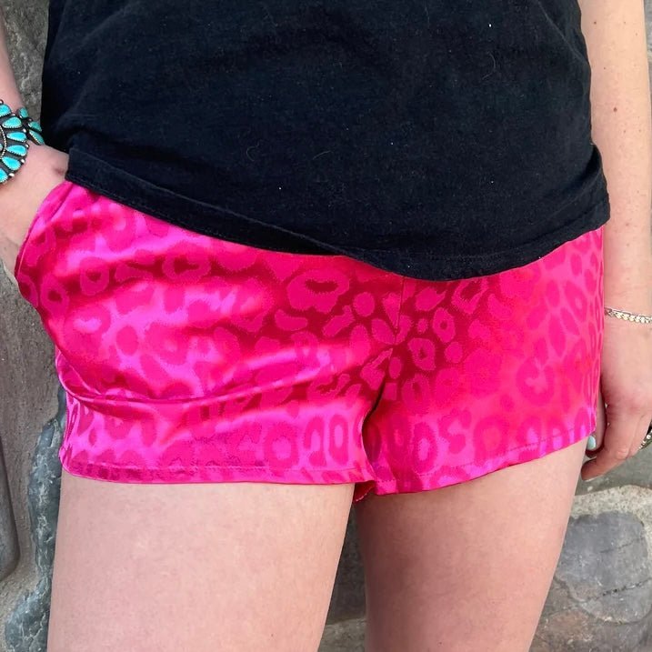 These Color Me Rosey Shorts are the purrfect way to hit the streets. Feel like royalty in this pink cheetah print with a silk-like feel and spacious pockets--royalty never carries a purse anyway. Live out your wildest dreams and show 'em what you're made of!   97% POLYESTER 3% SPANDEX