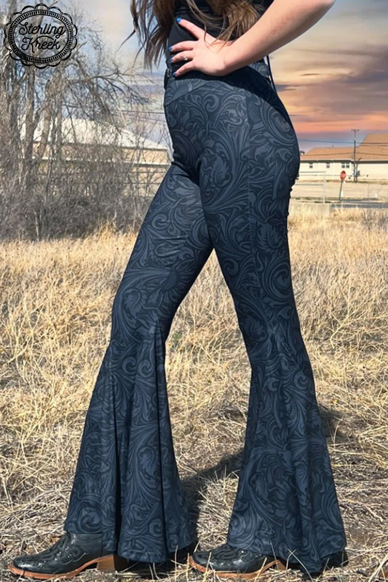 Grey days no more - liven up any ensemble with these fun and funky black tooled leather bell bottoms! With an on-trend fit and a classic design, you'll be ringing in many more fashionable moments. Wow the crowd with these bells!     92% POLYESTER 8% SPANDEX