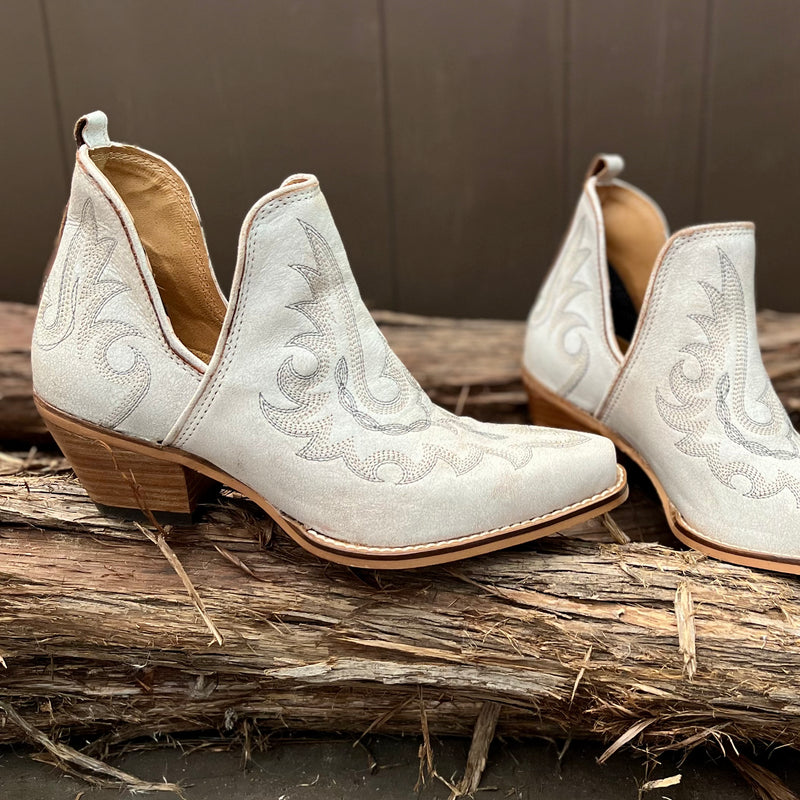 By Myra  Genuine cream leather notched ankle booties with decorative contrast stitching in tan. Pointed toe. Cushioned foot bed for optimal comfort.  Size down 1 size, these booties run big!!