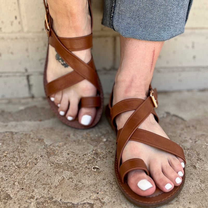 Make a statement with these "Walk On The Beach" sandals! Perfect for any vacay destination, these sling back sandals come in two chic colors - chestnut brown and black - and feature a toe ring for summery style. Plus, with an extra comfy cushion footbed, you can wear 'em all day and into the night! Ready, set, sea-yah!
