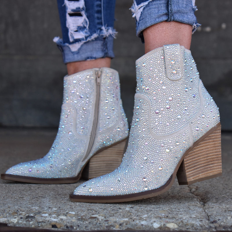 Add Glamour to any party with these "Kady" Silver Rhinestone Booties with allover rhinestone detailing. Pointed Toe Silhouette,  side zipper closure, 3" wooden block heel, 5" ankle length from ankle to top of bootie. 8 1/2" total inches tall from sole to top of Bootie. 