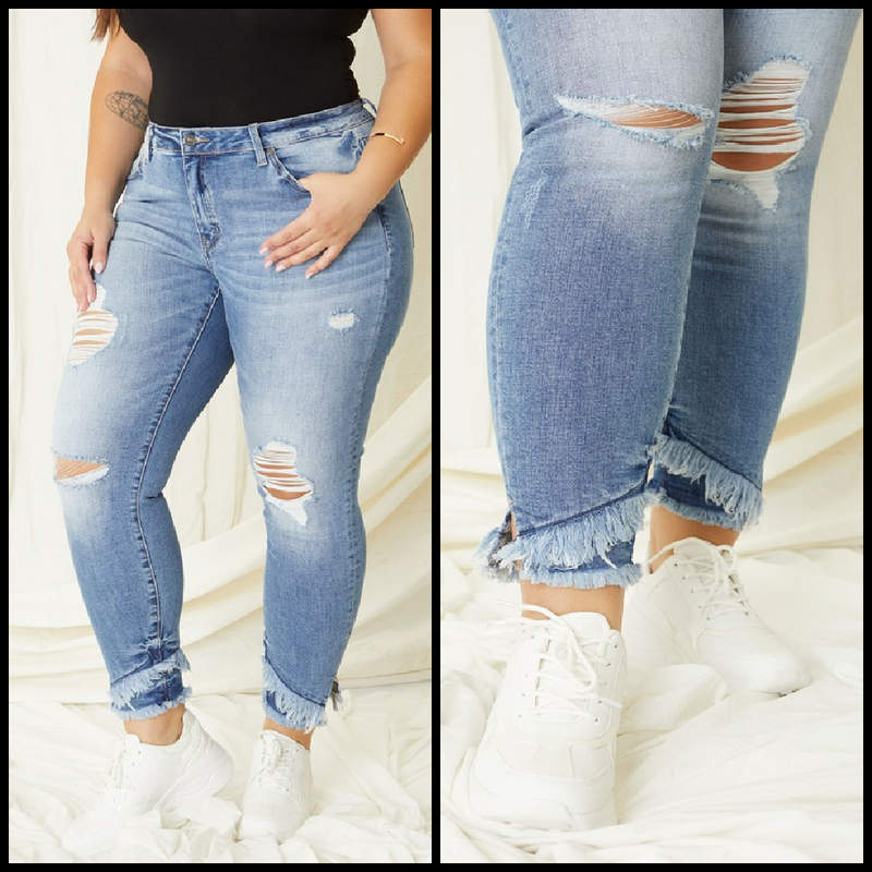 Kancan | Midrise ankle length skinny in medium wash with rips and asymmetrical frayed hem at the ankles.  98% cotton, 2% spandex   10.5" rise, 27.5" inseam