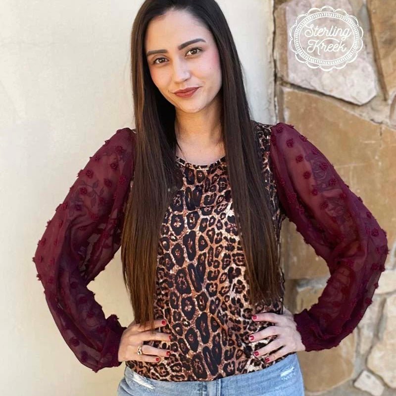 This Kitty In A Cradle Top by Sterling Creek is beautiful. The gorgeous leopard print top with red wine colored sheer dot sleeves sure one to catch the eye. The fabric is butter soft and a top you would be comfortable in all day. 32% Cotton, 56% Rayon, 12% Spandex   XS, S, M, L, XL