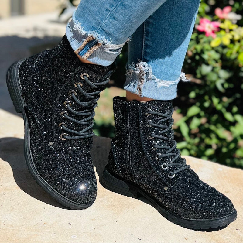 These Black Magic Sequin Combat Boots are a statement piece in themselves. Paired with a pair of skinny jeans would blow your outfit out of the water. The 6.5" tall boots are such a great fit. They lace up and have a inside zipper for a tighter fit.