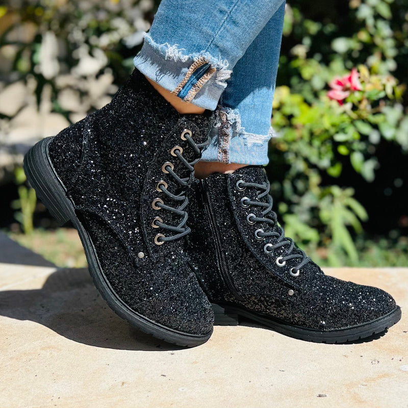 These Black Magic Sequin Combat Boots are a statement piece in themselves. Paired with a pair of skinny jeans would blow your outfit out of the water. The 6.5" tall boots are such a great fit. They lace up and have a inside zipper for a tighter fit.