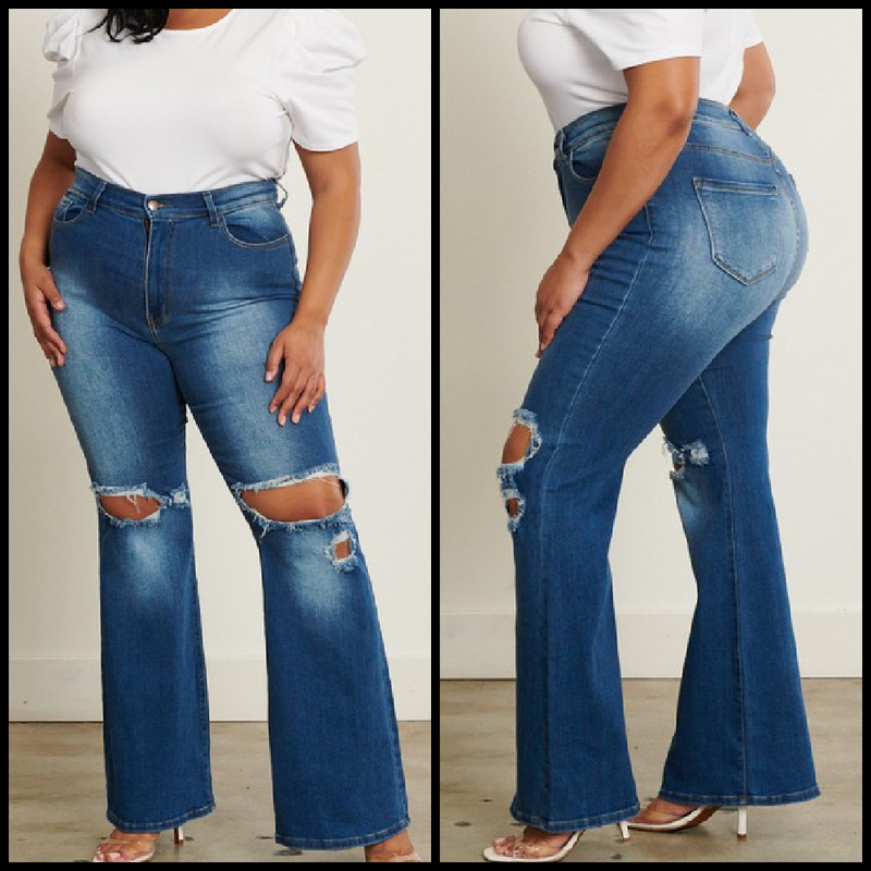 High waisted medium stone wash flare jeans with large knee cut outs.  93% cotton, 5% polyester, 2% spandex  Inseam: 33"  Rise: 12"
