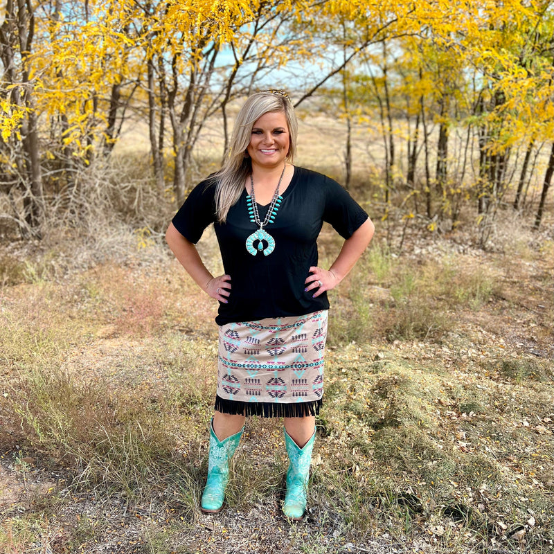 The Cheyenne Skirt by Sterling Kreek is adorable. The multiple colored Aztec print with the black fringe around the bottom completes the look of this cute skirt.  This skirt is so lightweight and butter soft. This skirt has so many options to either be dressed up with a jacket and boots or a simple top.  92% Polyester, 8% Spandex  XS, S, M, L, XL