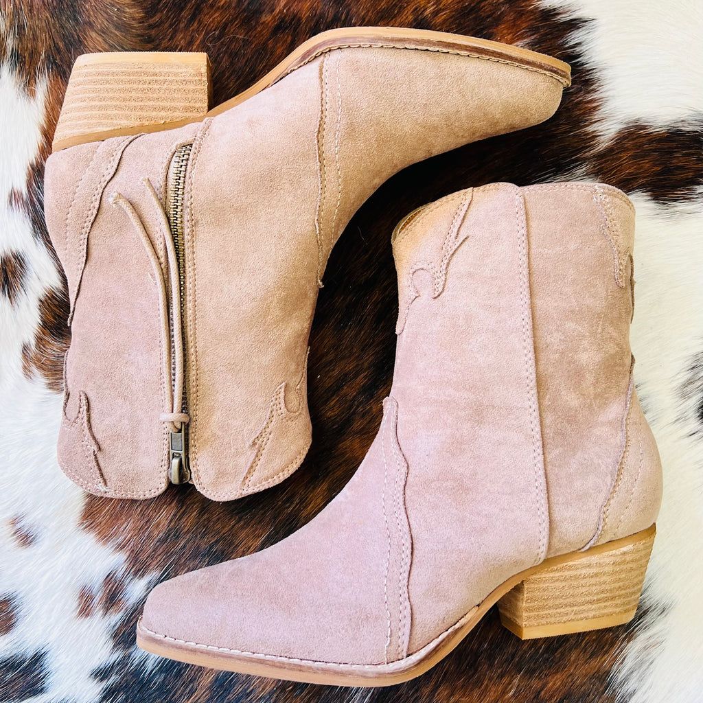 These taupe booties are covered in a suede like material, with side zipper closure, and a flattering 2 inch heel!    