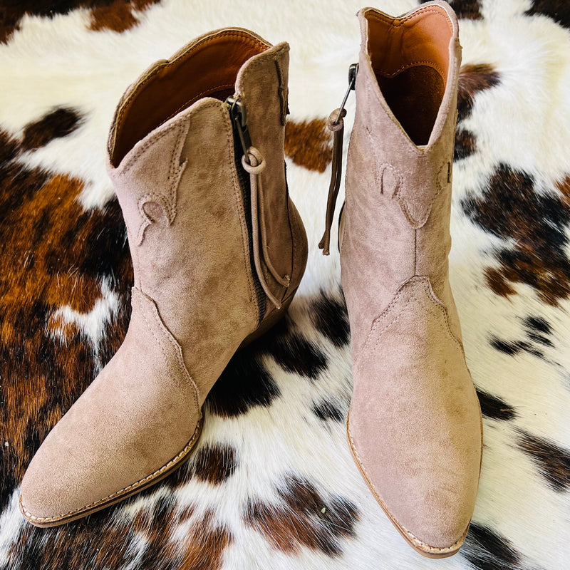 These taupe booties are covered in a suede like material, with side zipper closure, and a flattering 2 inch heel!    