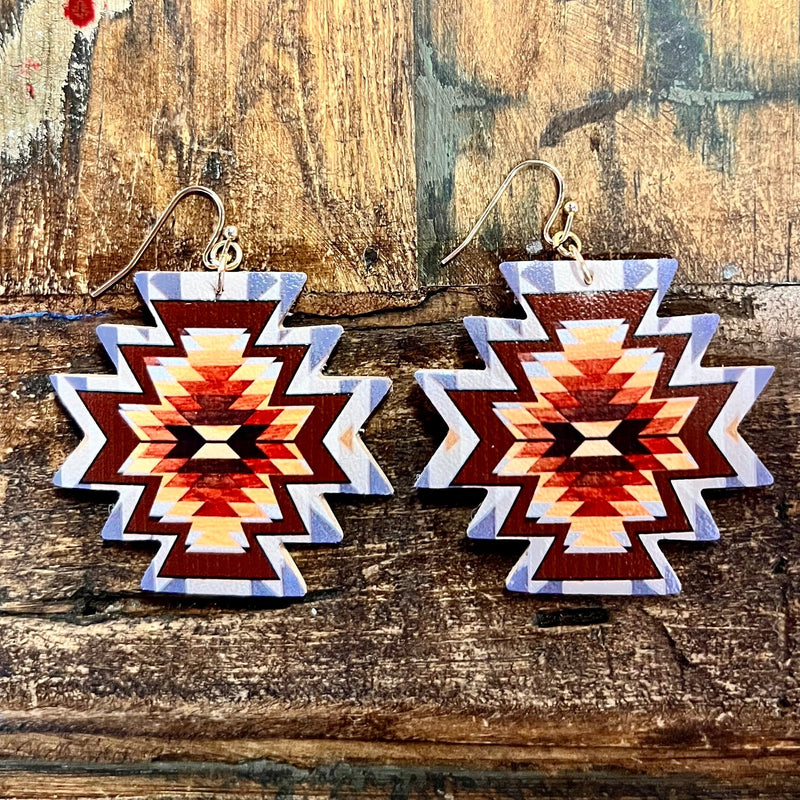 The Ancient Aztec Earrings are a 2" Aztec Cutout with a colorful Aztec Print Design. They are on a fish hook earring. They are very lightweight and beautiful with the color combination.  