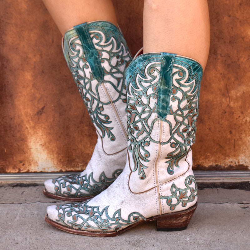 Tanner Mark | Hand-made turquoise tooling and brown embroidery embellished ivory leather boot. V-toe and a 1.5" inch heel.
