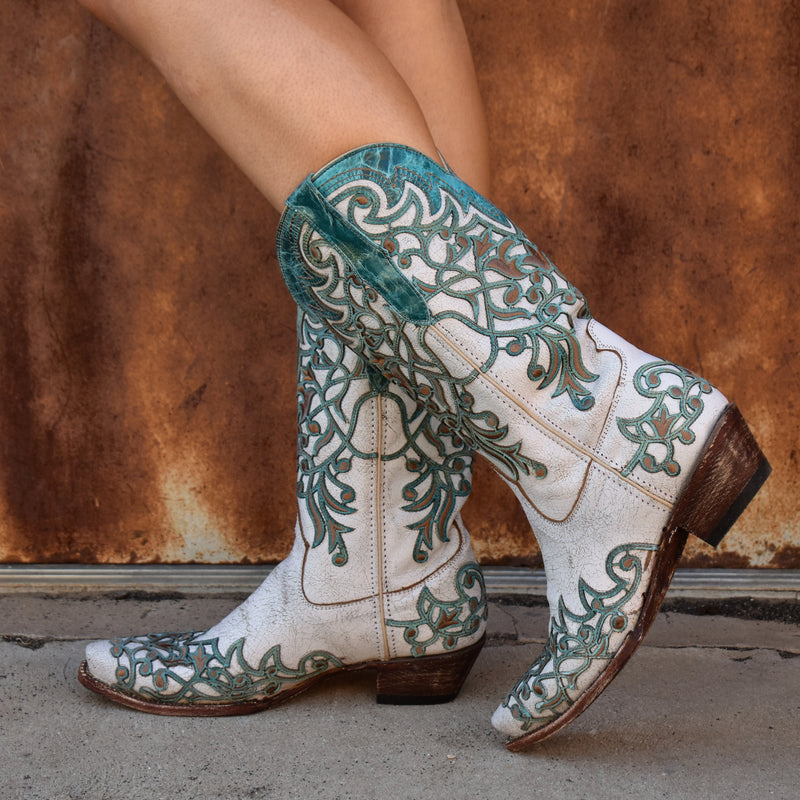 Tanner Mark | Hand-made turquoise tooling and brown embroidery embellished ivory leather boot. V-toe and a 1.5" inch heel.